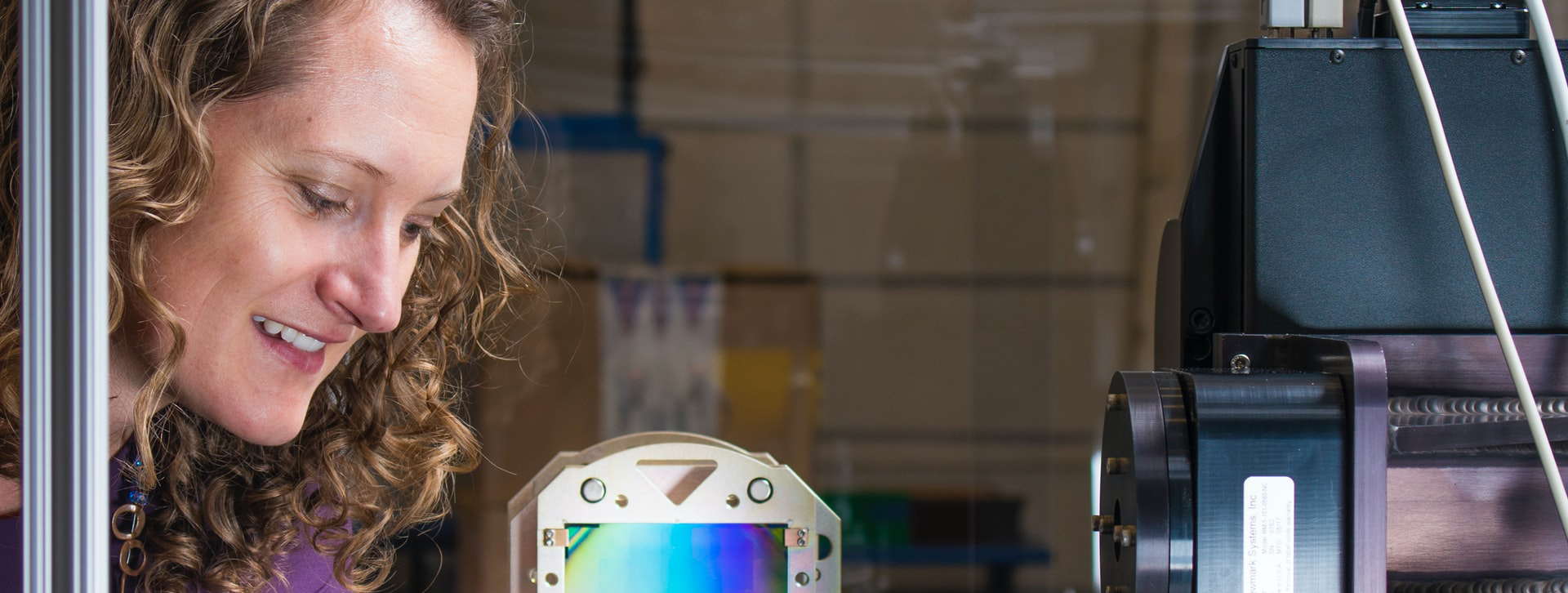 woman looking at colorful device