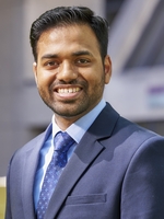 Man in business suit smiling at camera