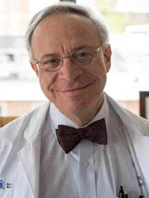 Dr Zeidel in bow tie and white coat