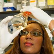 researcher with glass flask