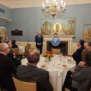 People posing for a picture at a dinner