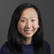 A professional headshot of Angela Chen