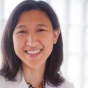 Neurologist standing in front a window