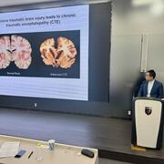 Chenxi Qiu presenting research on traumatic brain injury
