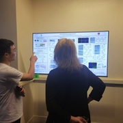 Dr. Zhaobo Luo explaining his research at SUFU