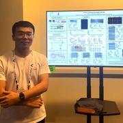 Dr. Luo by his poster at SUFU