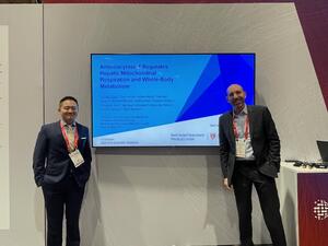 Dr. Mark Benson and Yuntian Guan at a conference