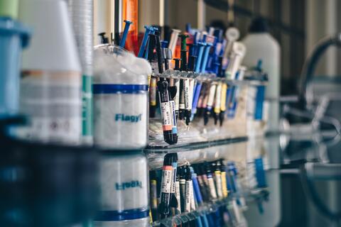 several syringes on a lab desk