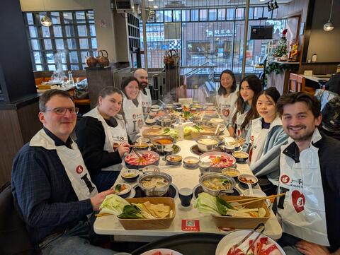 Lab lunch outing around a hot pot table with