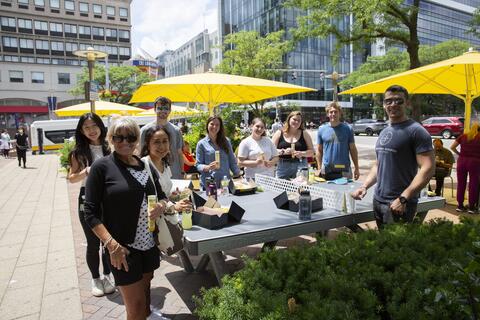 Nephrology research team enjoying employee appreciation lunch outside the Shapiro Building