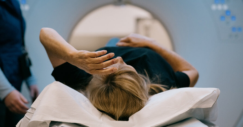A Women Laying in a MRI Machine 