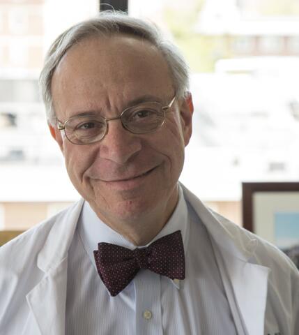 Dr. Zeidel in bow tie and lab coat