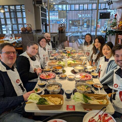 Lab lunch outing around a hot pot table with