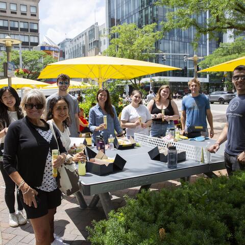 Nephrology research team enjoying employee appreciation lunch outside the Shapiro Building