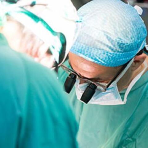 Close-up of two surgeons performing operation