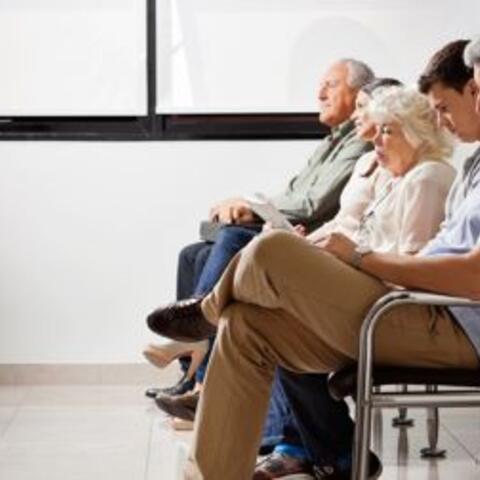 Patients sit in waiting room