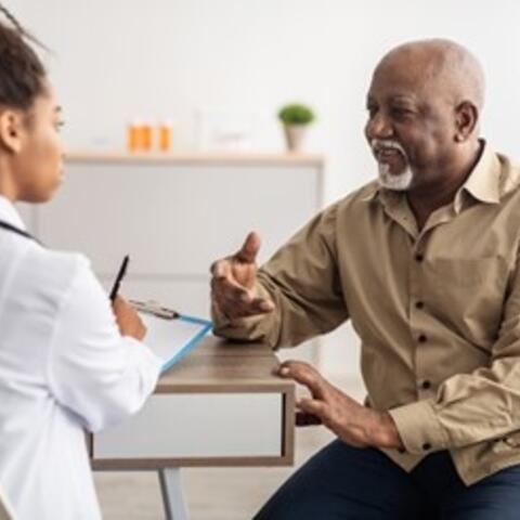 Stock image of a Dr. talking with a patient