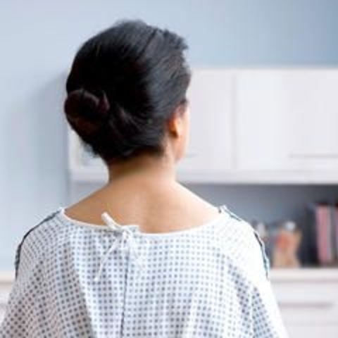 A patient in a medical gown