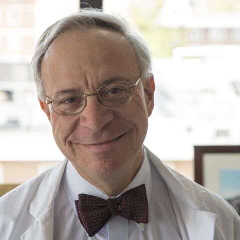 Dr. Zeidel in bow tie and lab coat