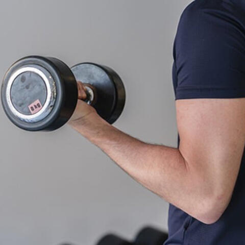 man lifting weights