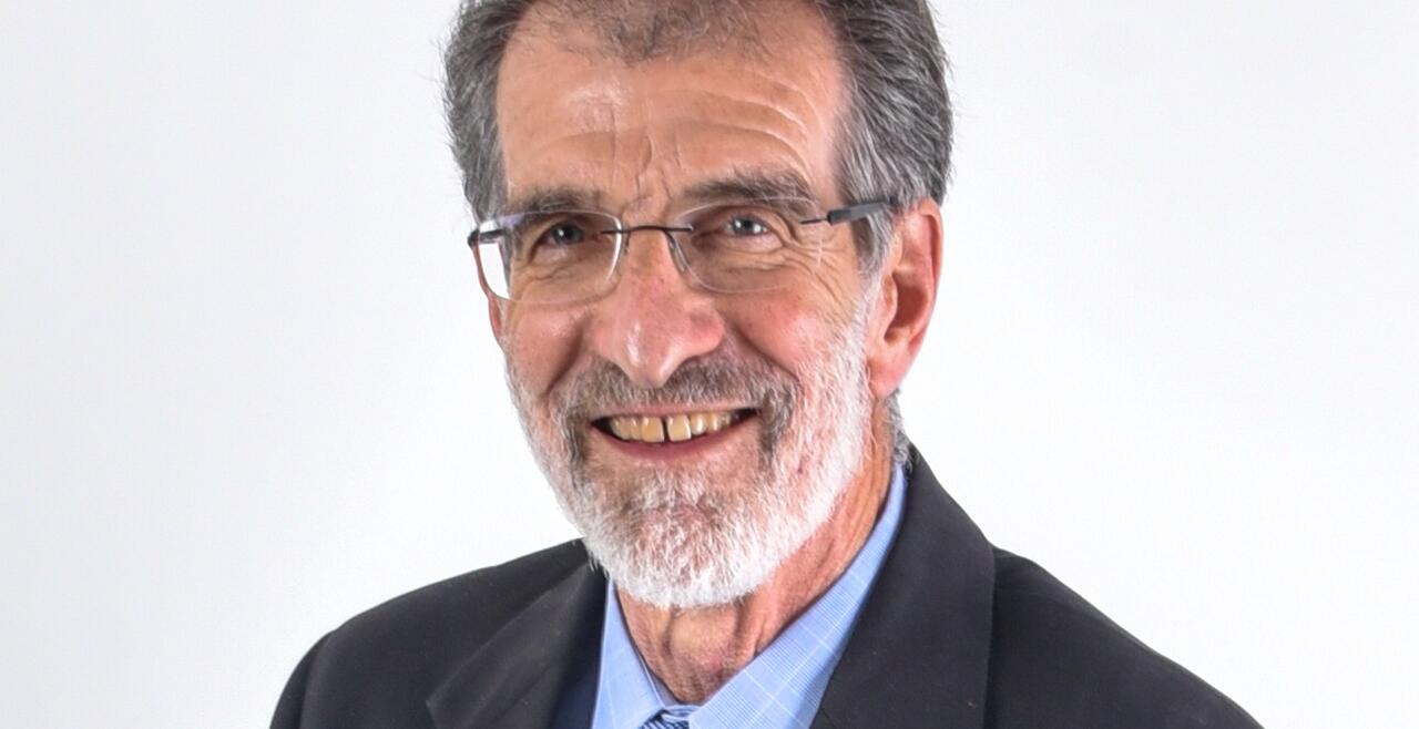 Dr.Daniel g. Tenen. An older gentlmen with glasses and an abundance of hair. 