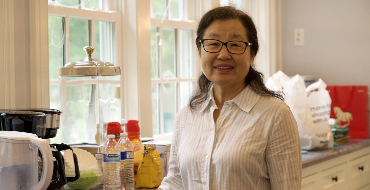 Junyan Zhang, a distinguished and lovely looking woman with glasses. 