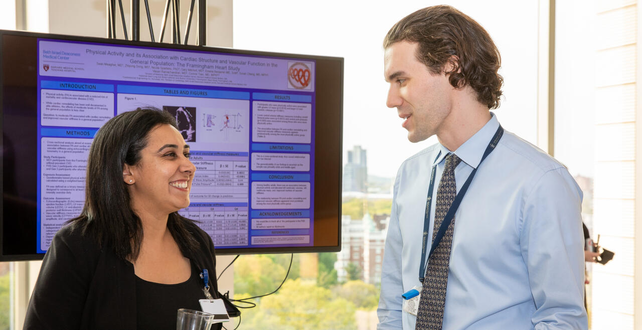 Resident and program director Aarti Asnani discussing resident's research project