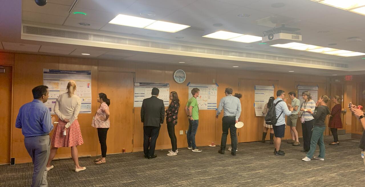Image of many people at poster session