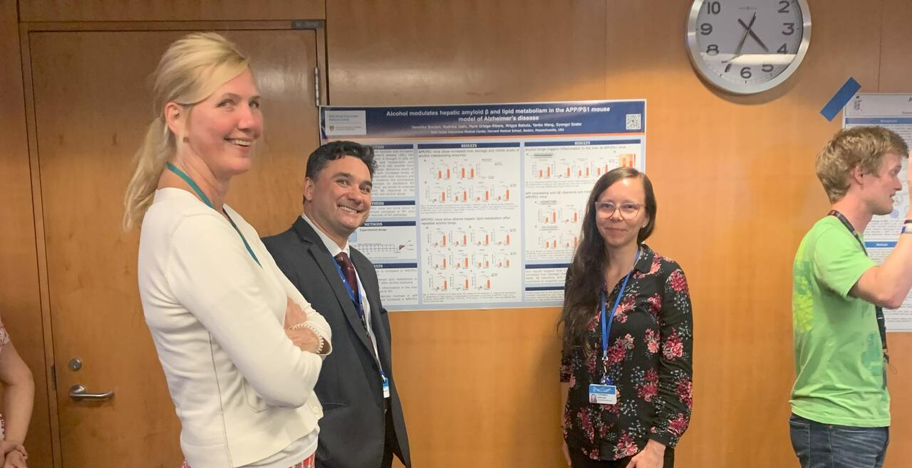 Image of postdoctoral fellows presenting poster