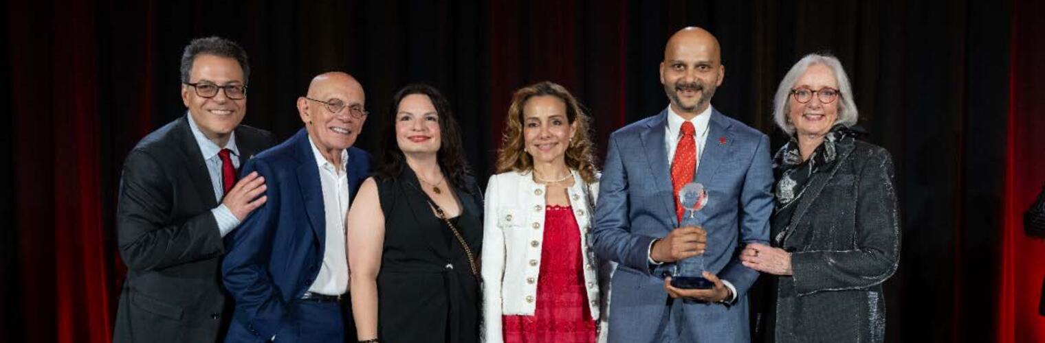 Dr. Kazi receiving the AHA Ron Haddock International Impact Award