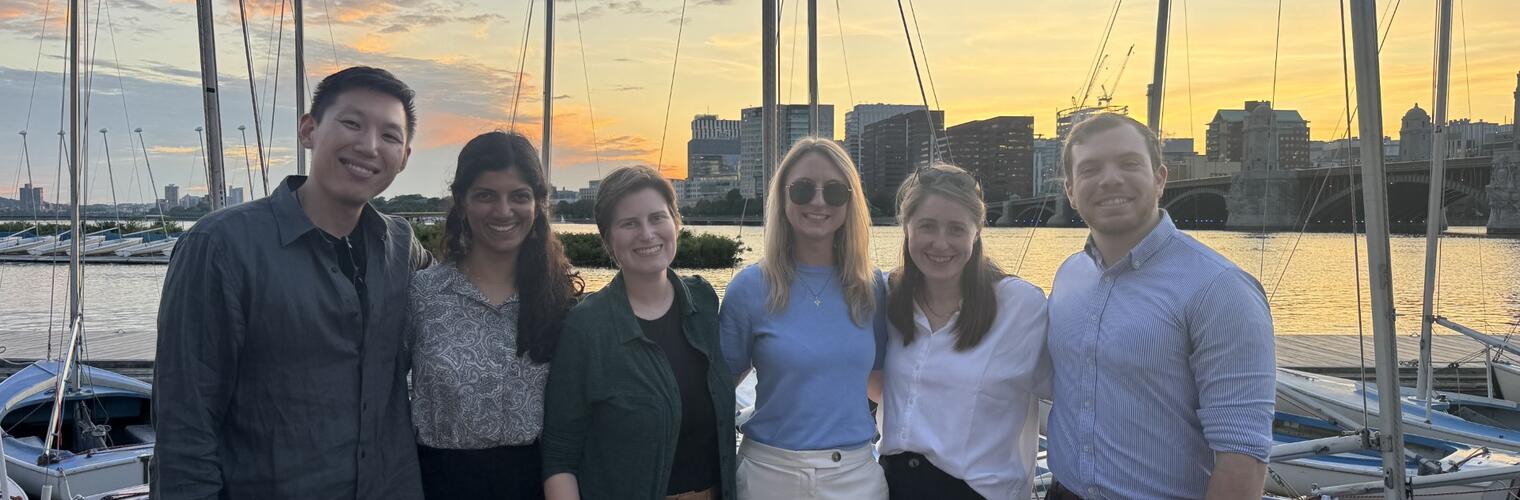 The 2025-26 Chief Medical Residents group photo with sunset behind them