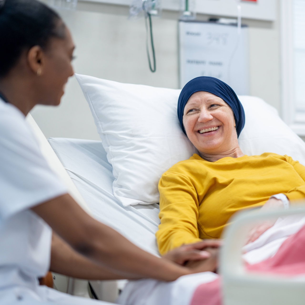 Woman in a hospital bed doing chemotherapy