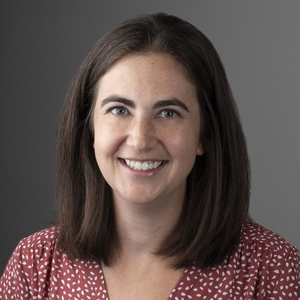 Picture of white woman smiling with shoulder length straight brown hair