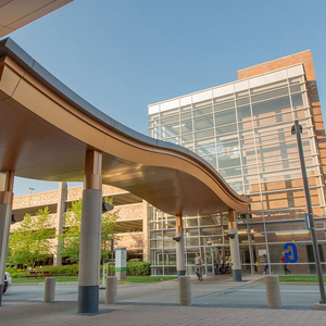Entrance to Lahey with a curved canopy and glass walls