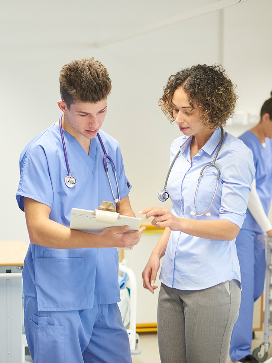 Graduate Medical Students looking at a patient file